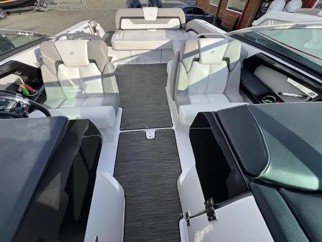 Slide: The Image of 2019 Four Winns H290 OB boat interior with sleek seating and modern design. - 44