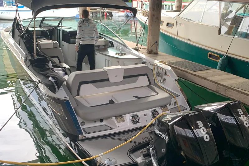 Slide: The Image of 2019 Four Winns H290 OB boat docked with dual Mercury engines. - 6