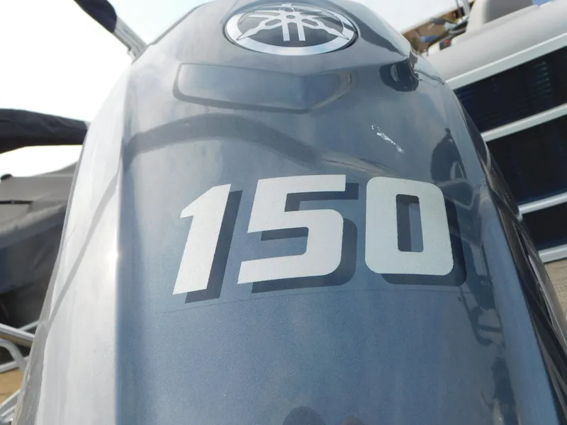 Slide: The Image of Close-up of Yamaha 150 outboard engine on 2023 Bennington 22SXSR boat. - 11