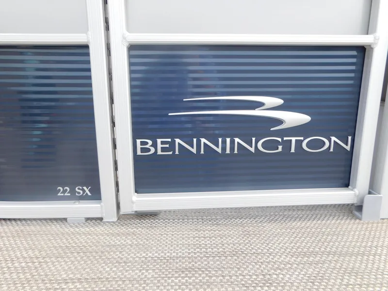 Slide: The Image of 2023 Bennington 22SXSR boat panel with logo and model name. - 2