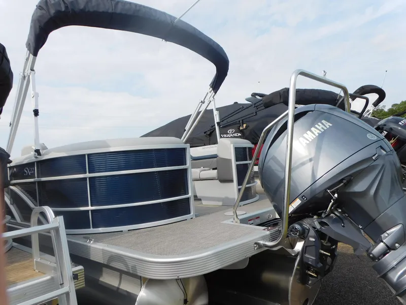 Slide: The Image of 2023 Bennington 22SXSR pontoon boat with Yamaha engine, docked and ready for use. - 3