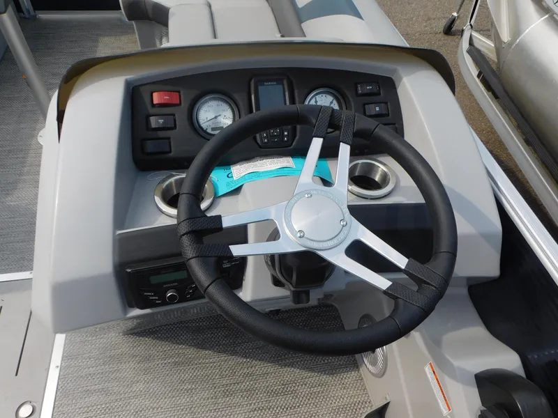 Slide: The Image of Dashboard of 2023 Bennington 22SXSR boat with steering wheel and gauges. - 6