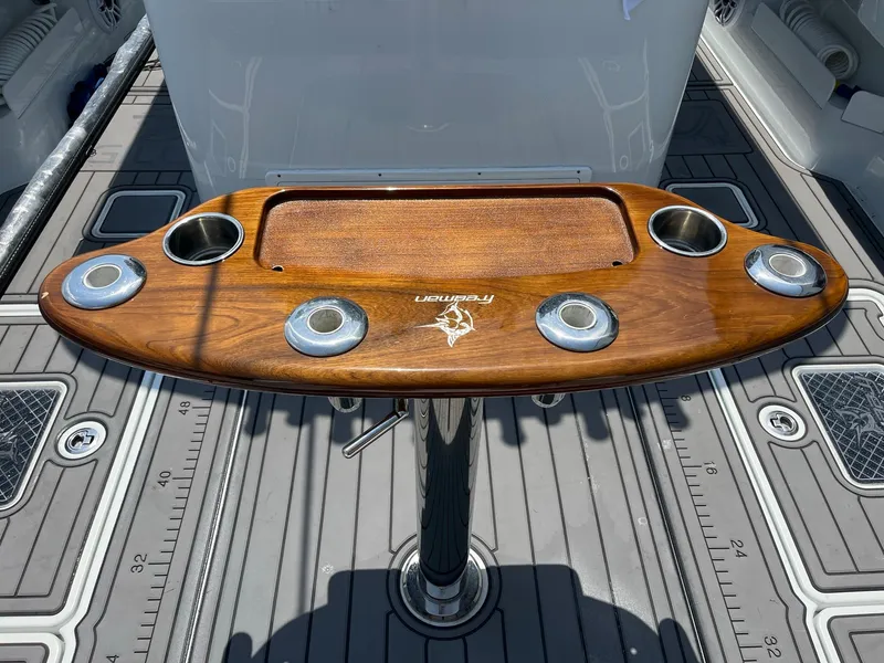 Slide: The Image of Freeman 37 VH 2021 boat with wooden fishing rod holder and cup holders. - 11