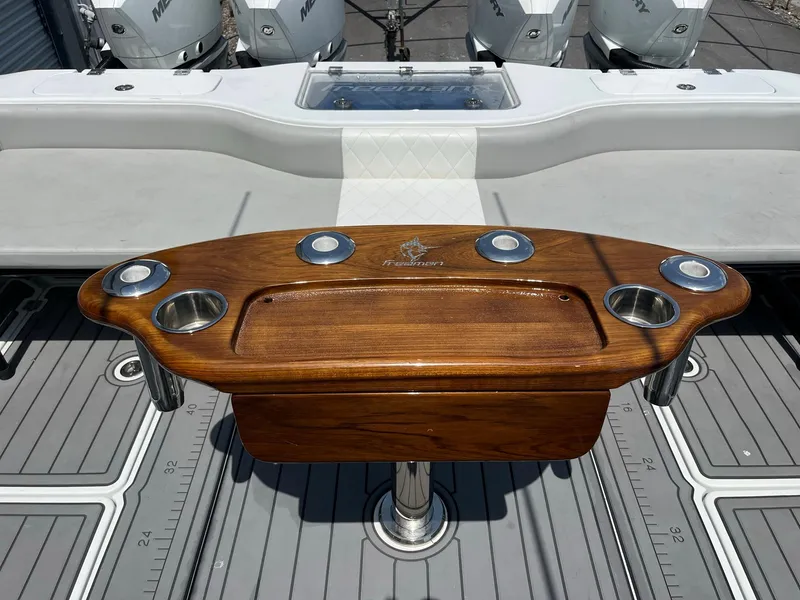 Slide: The Image of Freeman 37 VH 2021 boat with wooden fishing station and multiple rod holders. - 13