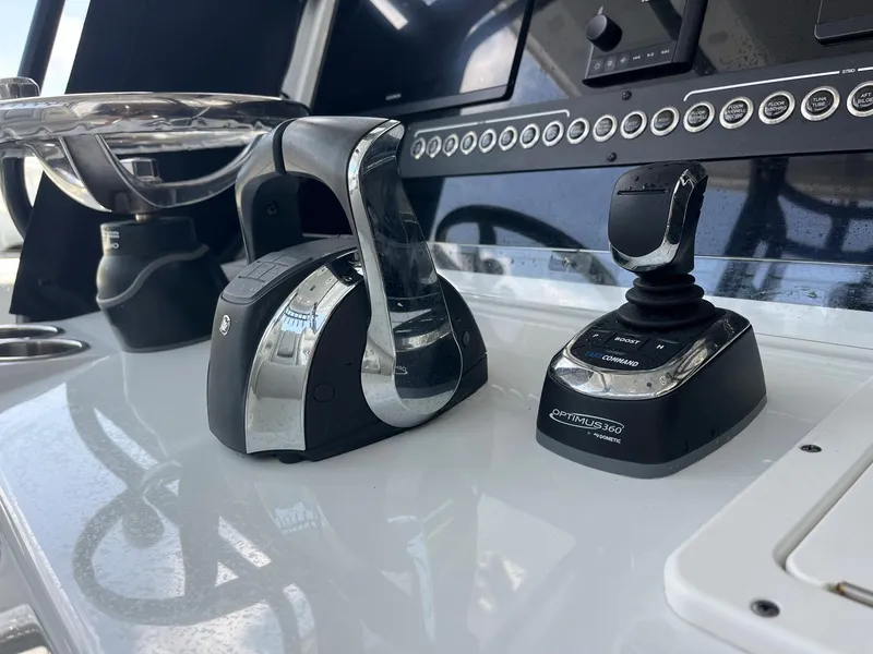Slide: The Image of Freeman 37 VH 2021 boat control panel with throttle and joystick. - 17