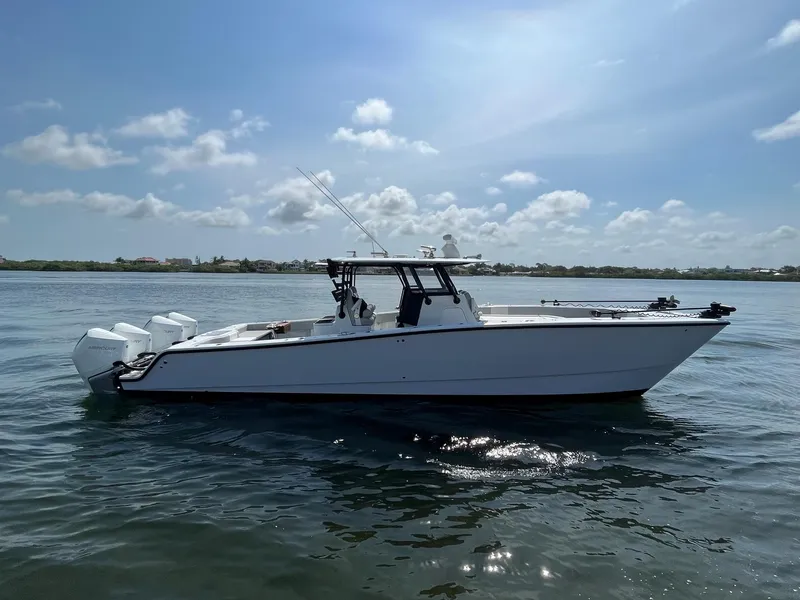 Slide: The Image of 2021 Freeman 37 VH boat on calm water under a sunny sky. - 2