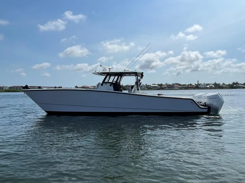 Slide: The Image of 2021 Freeman 37 VH boat on calm water under a clear sky. - 22
