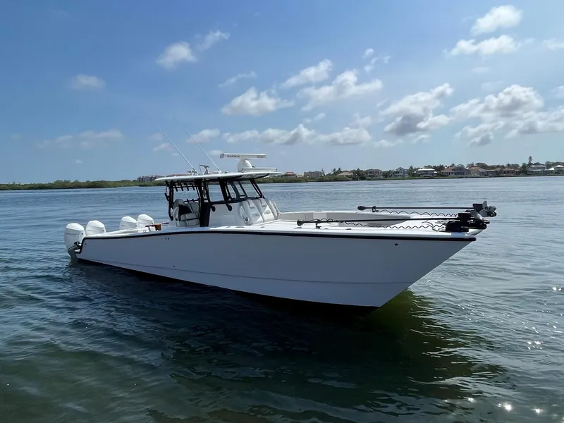 Slide: The Image of 2021 Freeman 37 VH boat on calm water under a clear sky. - 3