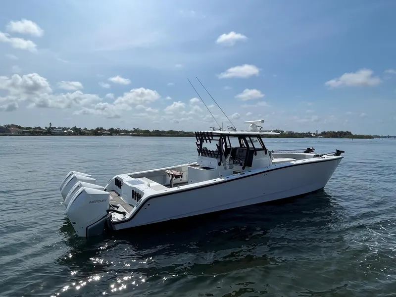 Slide: The Image of 2021 Freeman 37 VH boat on calm waters under a clear sky. - 4