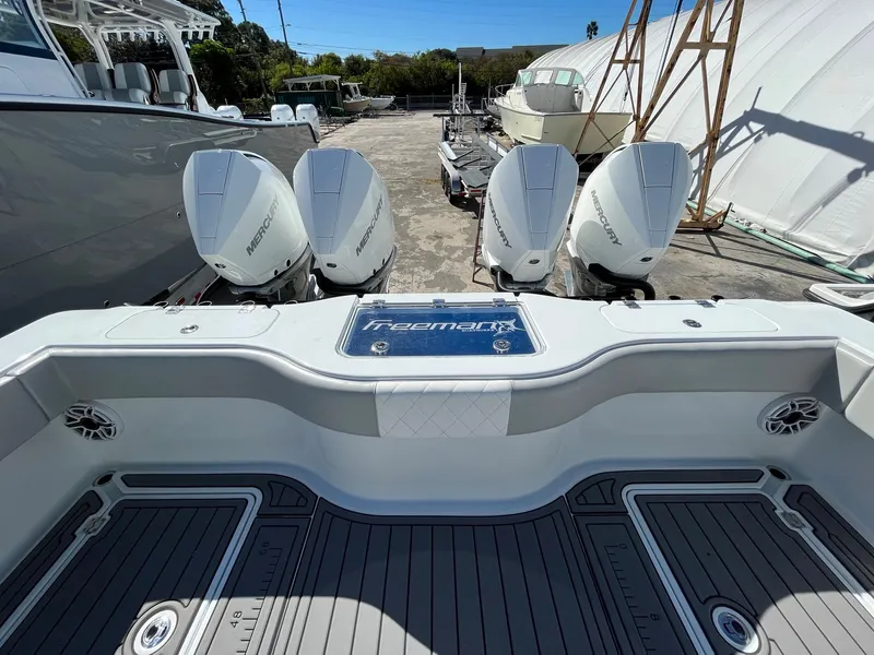 Slide: The Image of Freeman 37 VH 2021 boat with quad Mercury outboard engines in a marina. - 9