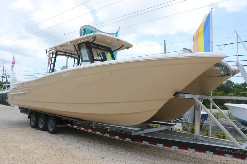 The Image of 2023 World Cat 400CC-X boat on trailer, side view. - 0