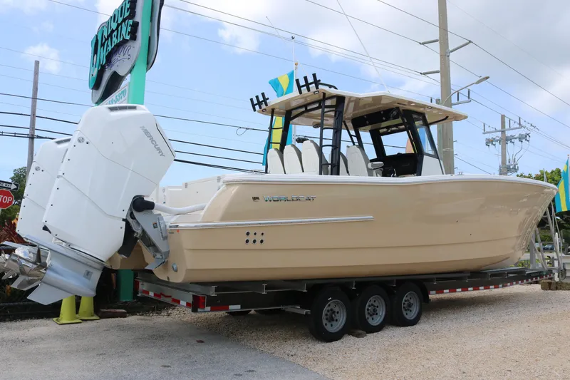 Slide: The Image of 2023 World Cat 400CC-X boat on a trailer at a marina. - 1