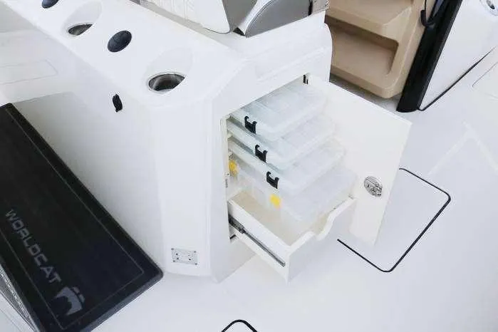 Slide: The Image of 2023 World Cat 400 CC-X boat with open storage compartments and tackle boxes. - 12