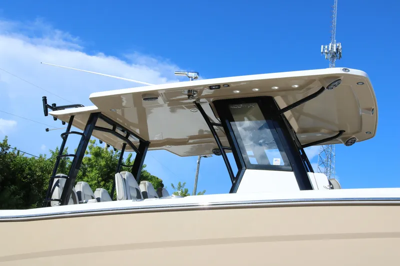 Slide: The Image of 2023 World Cat 400 CC-X boat with sleek design and modern canopy. - 2