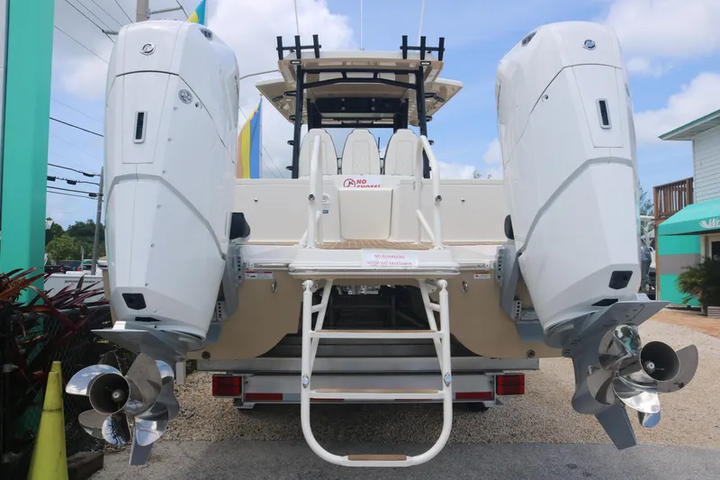 Slide: The Image of 2023 World Cat 400CC-X boat with dual outboard engines, rear view. - 3