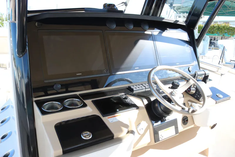 Slide: The Image of 2023 World Cat 400 CC-X helm with dual screens and modern controls. - 5