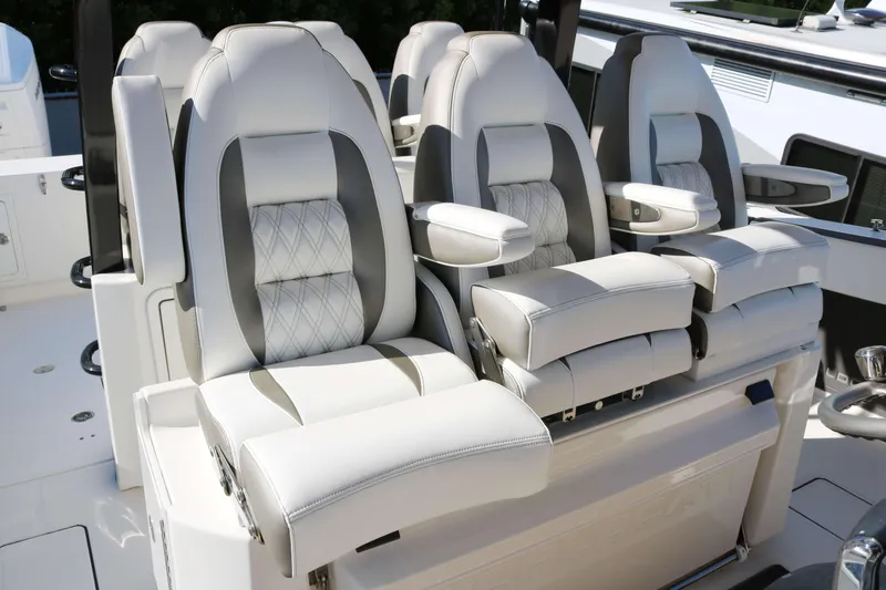 Slide: The Image of Luxurious seating on 2023 World Cat 400 CC-X boat, featuring plush, ergonomic design. - 6