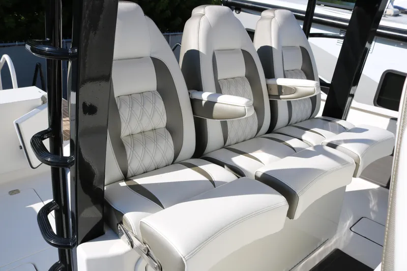 Slide: The Image of Luxurious seating on 2023 World Cat 400 CC-X boat, featuring elegant white and gray upholstery. - 7