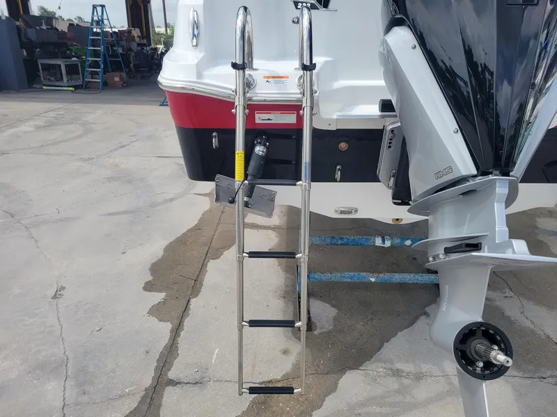 Slide: The Image of 2024 Wellcraft 222 Fisherman boat with ladder and outboard motor. - 10