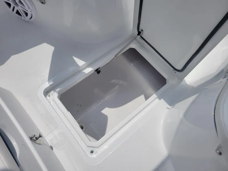 Slide: The Image of 2024 Wellcraft 222 Fisherman storage compartment open. - 18