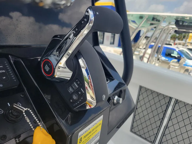 Slide: The Image of 2024 Wellcraft 222 Fisherman boat throttle control and dashboard. - 21