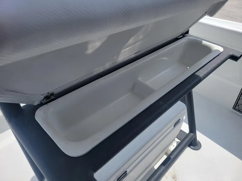 Slide: The Image of Open storage compartment on a 2024 Wellcraft 222 Fisherman boat. - 25