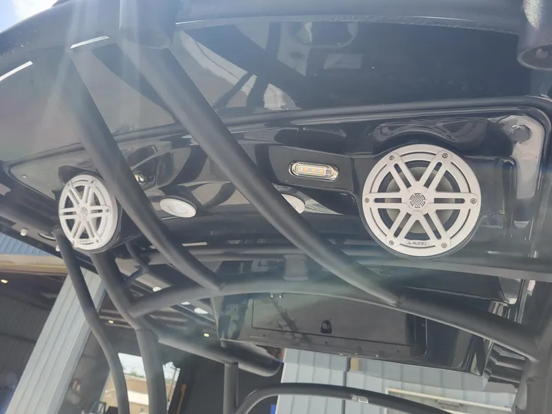 Slide: The Image of 2024 Wellcraft 222 Fisherman boat with mounted speakers and lighting. - 26