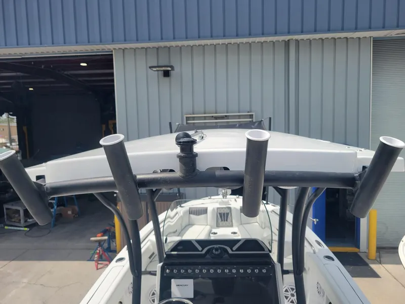 Slide: The Image of 2024 Wellcraft 222 Fisherman boat with rod holders and console. - 27