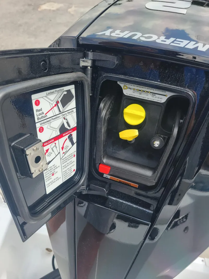 Slide: The Image of Close-up of a 2024 Wellcraft 222 Fisherman boat's Mercury engine compartment. - 29