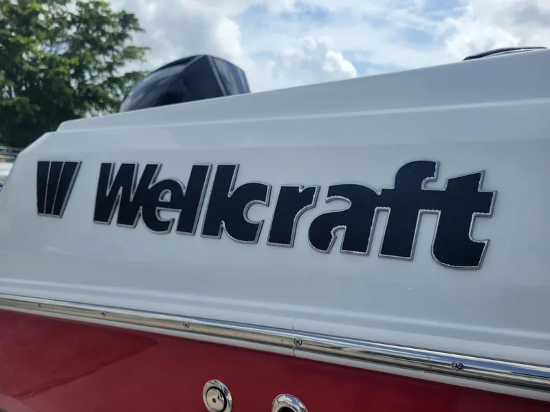 Slide: The Image of 2024 Wellcraft 222 Fisherman boat logo close-up. - 5