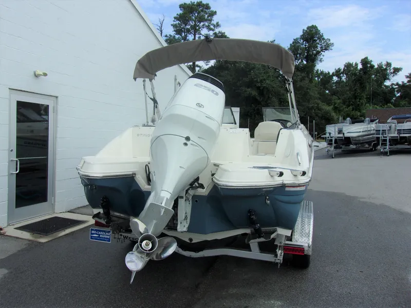 Slide: The Image of 2023 Stingray 231 DC boat on trailer, rear view. - 9
