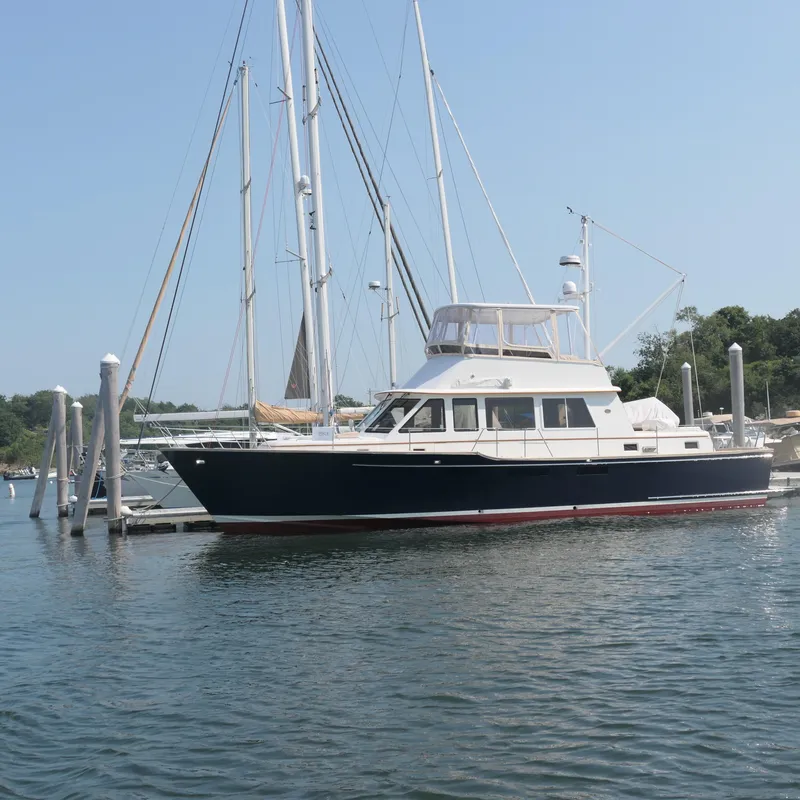 The Image of Alden 2020 motor yacht docked at marina, clear sky, calm water. - 0