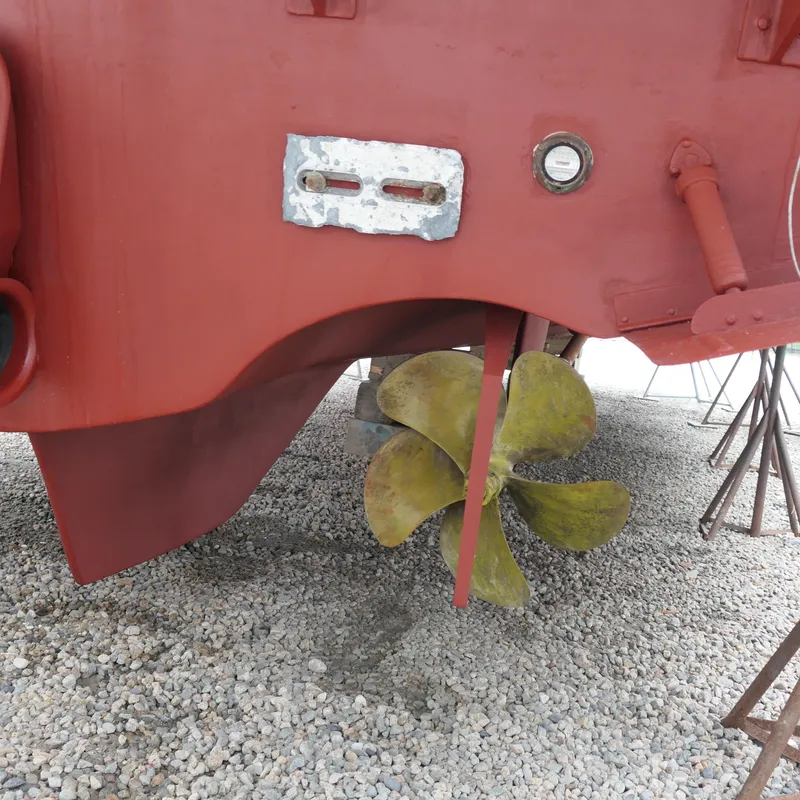 Slide: The Image of Alden Motor Yacht 2020 propeller and hull on gravel surface. - 10