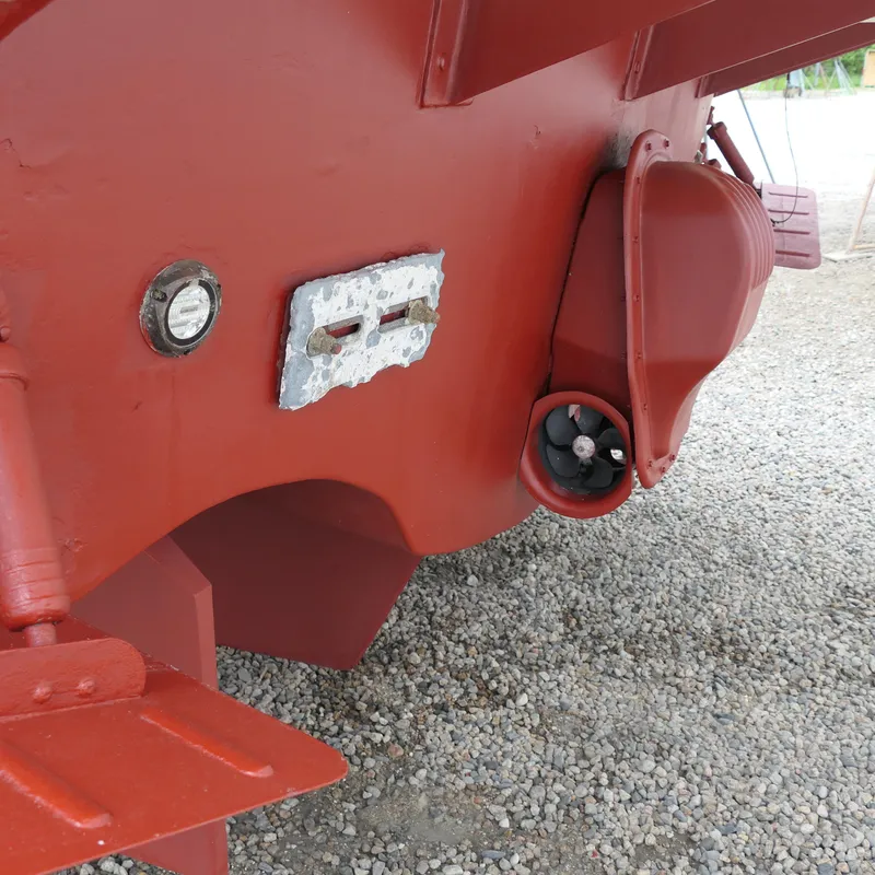 Slide: The Image of Red hull of 2020 Alden Motor Yacht, showing propeller and fittings. - 12