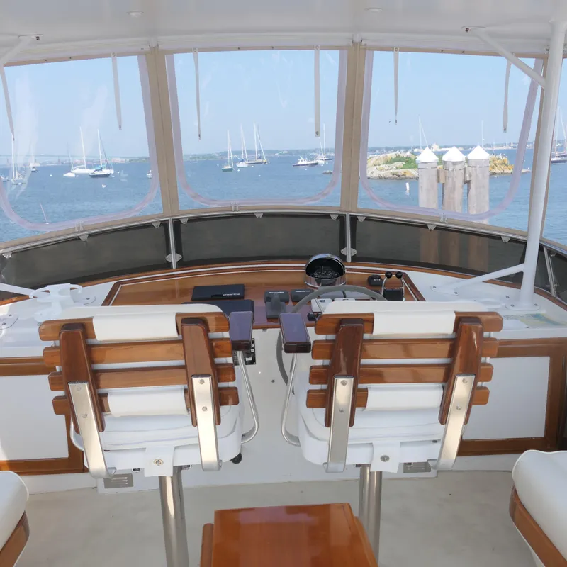 Slide: The Image of Interior view of 2020 Alden Motor Yacht helm with ocean backdrop. - 13