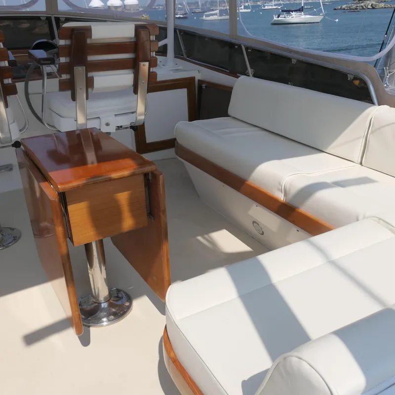 Slide: The Image of Luxurious 2020 Alden Motor Yacht interior with white seating and wooden accents. - 14