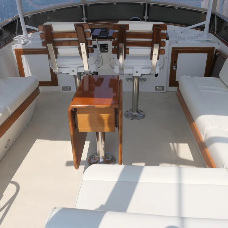 Slide: The Image of Luxurious 2020 Alden Motor Yacht interior with elegant seating and polished wood accents. - 17
