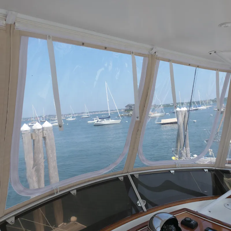 Slide: The Image of View from 2020 Alden Motor Yacht, overlooking marina with sailboats and clear skies. - 20