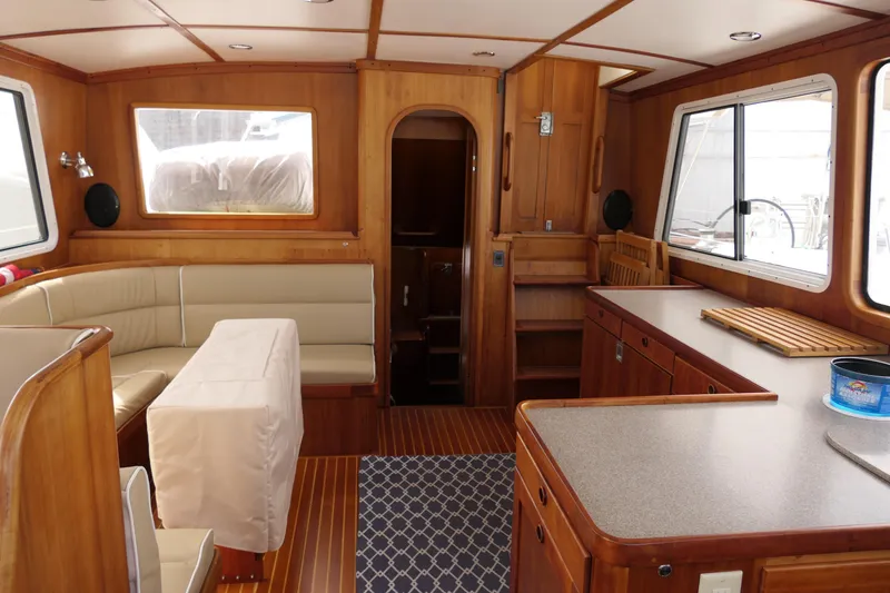 Slide: The Image of Luxurious 2020 Alden Motor Yacht interior with wood finish and comfortable seating. - 23