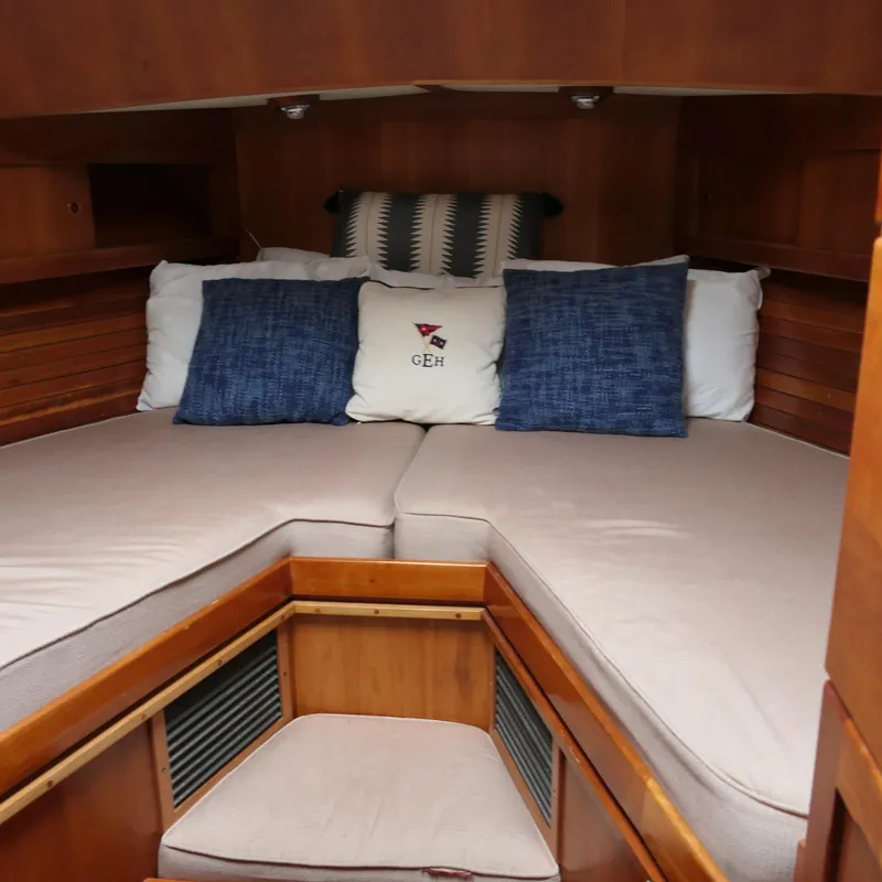 Slide: The Image of Cozy cabin interior of 2020 Alden Motor Yacht with plush bedding and cushions. - 29
