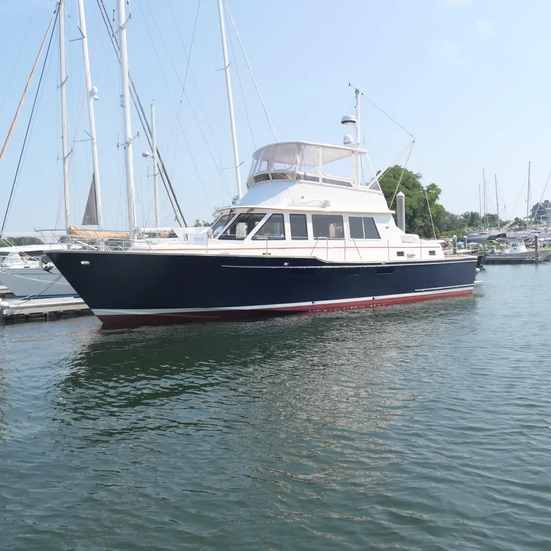 Slide: The Image of 2020 Alden Motor Yacht docked in a marina, featuring sleek design and modern amenities. - 3