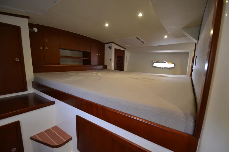 Slide: The Image of Luxurious bedroom interior of 2022 ArrowCat 42 Coupe yacht with wooden cabinetry. - 12