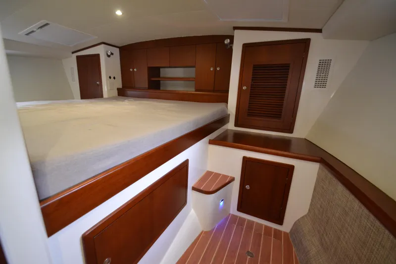 Slide: The Image of Interior cabin of 2022 ArrowCat 42 Coupe with wooden cabinetry and bed. - 14