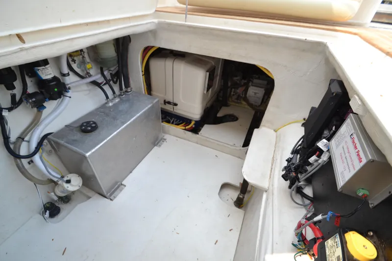 Slide: The Image of Engine compartment of a 2022 ArrowCat 42 Coupe with various mechanical components. - 17