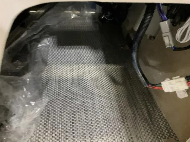 Slide: The Image of 2024 Bennington 218 SL interior wiring and flooring detail. - 12