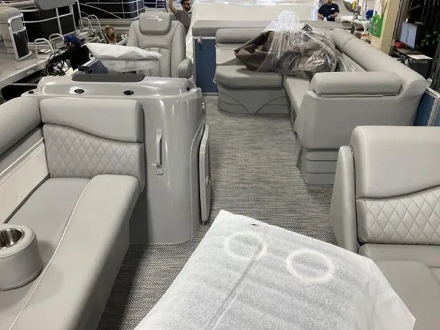 Slide: The Image of 2024 Bennington 218 SL pontoon boat interior with luxurious seating and modern design. - 15