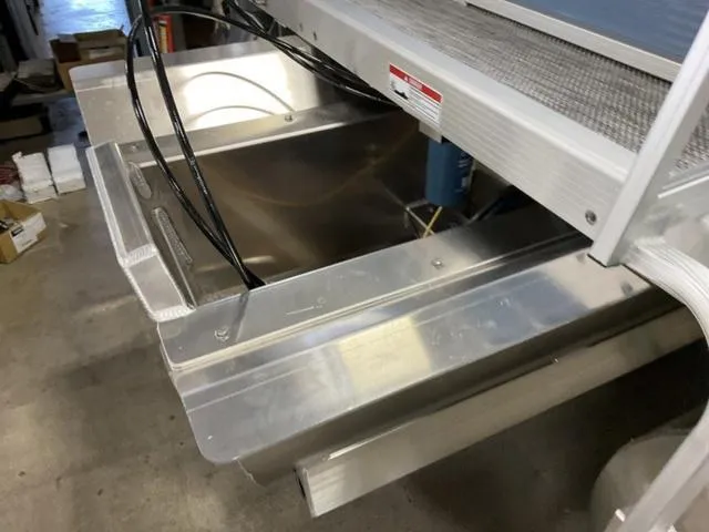 Slide: The Image of 2024 Bennington 218 SL pontoon boat under construction in a workshop. - 5