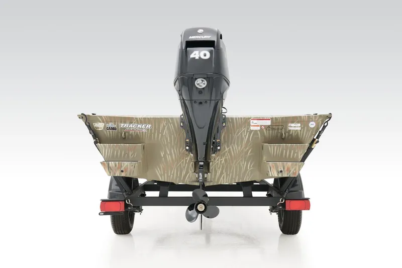 Slide: The Image of 2023 Tracker Grizzly 1654 T Sportsman boat, rear view with camo design and Mercury engine. - 15