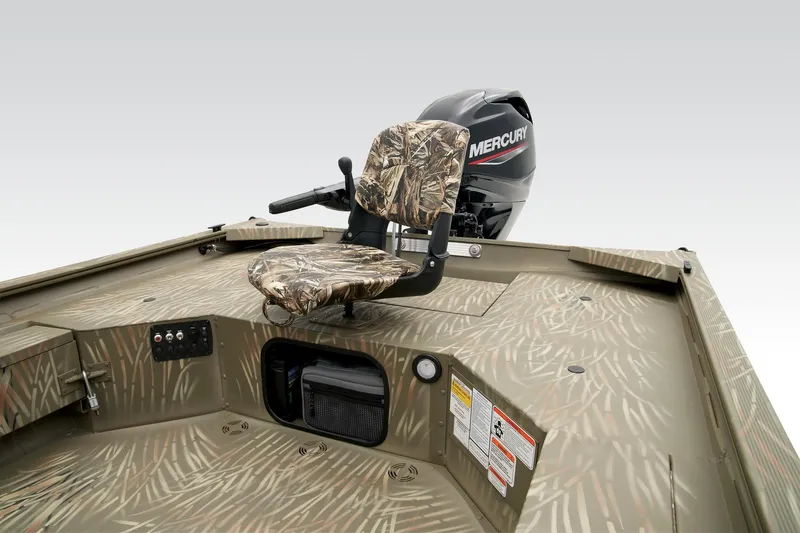Slide: The Image of 2023 Tracker Grizzly 1654 T Sportsman boat with camo seat and Mercury engine. - 25