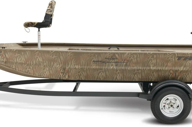 Slide: The Image of 2023 Tracker Grizzly 1654 T Sportsman boat with camouflage design on trailer. - 29